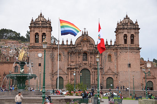 Cathedral of Santo Domingo Plaza de Armas of Cusco seven-striped rainbow flag of Cusco Peru UNESCO World Heritage Site Peru worldtimezone travel