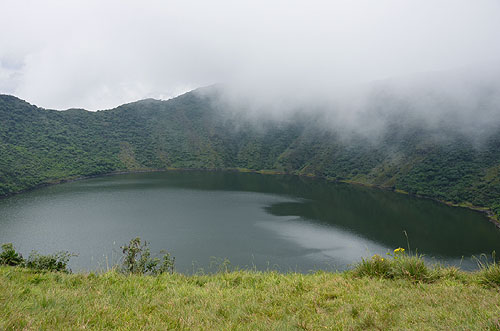 Volcano Bisoke crater lake Virunga Mountains border of Rwanda and Democratic Republic of the Congo photo Alexander Krivenyshev WorldTimeZone