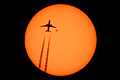 Airplane passing in front of the Sun with sunspot AR2529 high above Manhattan, New York 