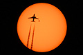 Airplane passing in front of the Sun with sunspot AR2529 high above Manhattan, New York 