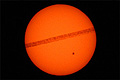 Airplane jet contrail in front of the sun with sunspot AR2529 photo taken from Weehawken, New Jersey