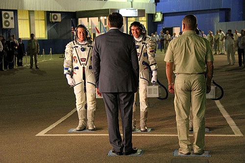 Soyuz TMA-02M crew makes their official report of readiness before getting on the bus to the rocket at the Baikonur cosmodrome Baikonur cosmodrome tour