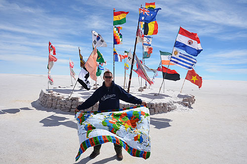 WorldTimeZone kanga next to the International flags Salt Hotel at the Salar de Uyuni in Bolivia worldtimezone travel