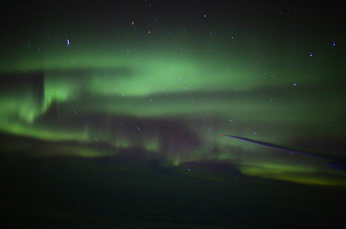 northern lights aurora borealis observed on a plane Photo Alexander Krivenyshev WorldTimeZone