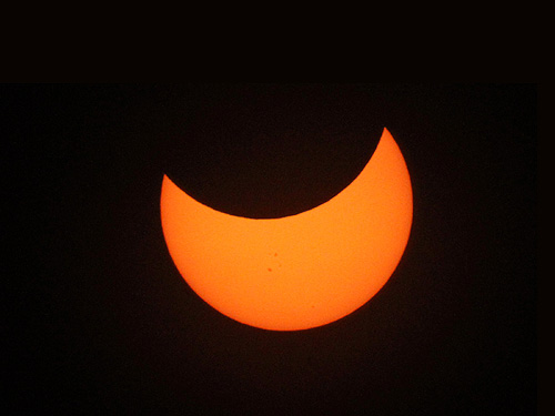 Partial phase of solar eclipse after totality near Pakwach on November 3 2013 photo Alexander Krivenyshev WorldTimeZone