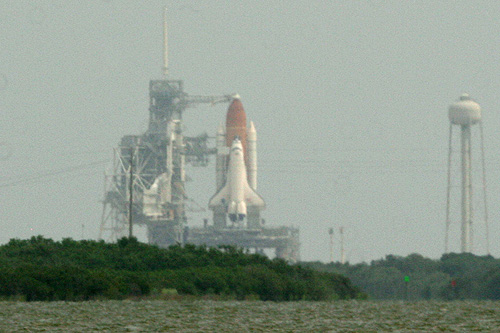 Space shuttle Atlantis before final lift off on july 8 2011 View from NASA Causeway 6 miles away from launch pad 39A photo Alexander Krivenyshev World Time Zone